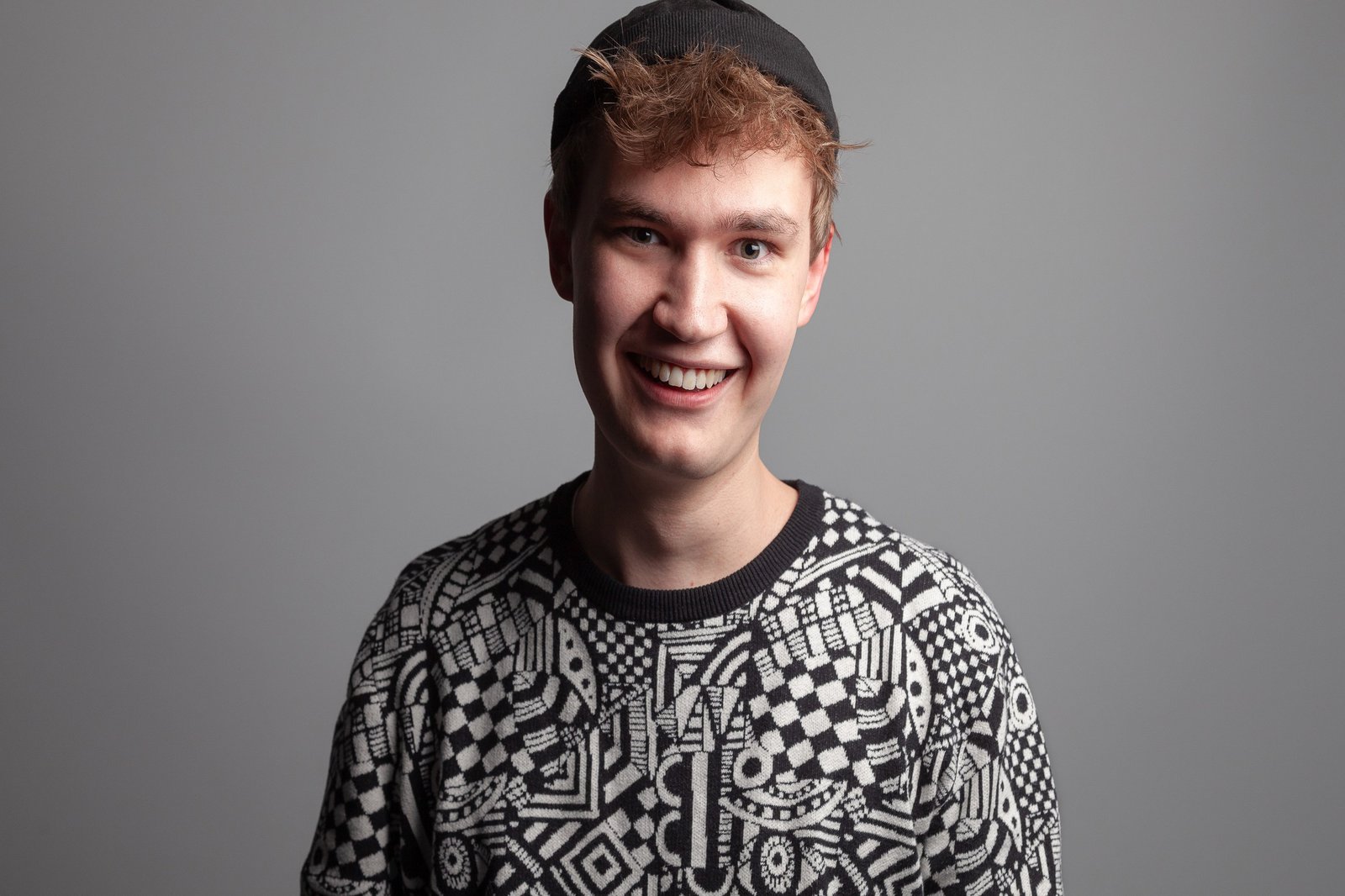 Portrait of a young man wearing a cap